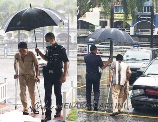 Abang polis payung warga emas ketika hujan terima penghargaan